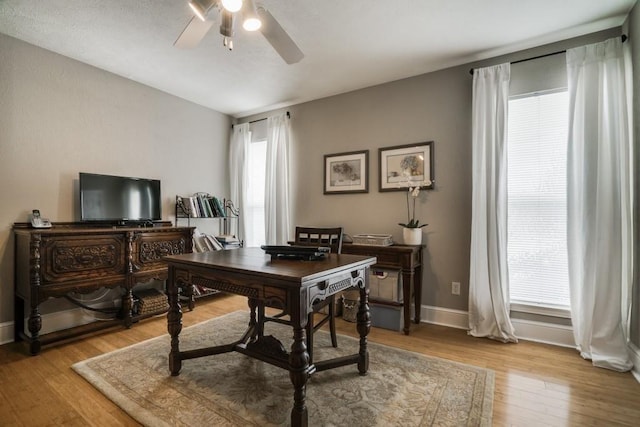 empty room with light wood-style flooring, recessed lighting, baseboards, and lofted ceiling