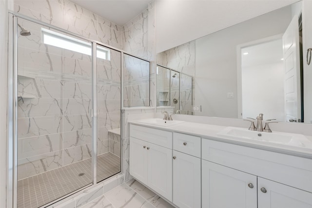 4301 Ruth Rd, North Richland Hills, TX 76180 - bathroom featuring double vanity, a shower stall, marble finish floor, and a sink
