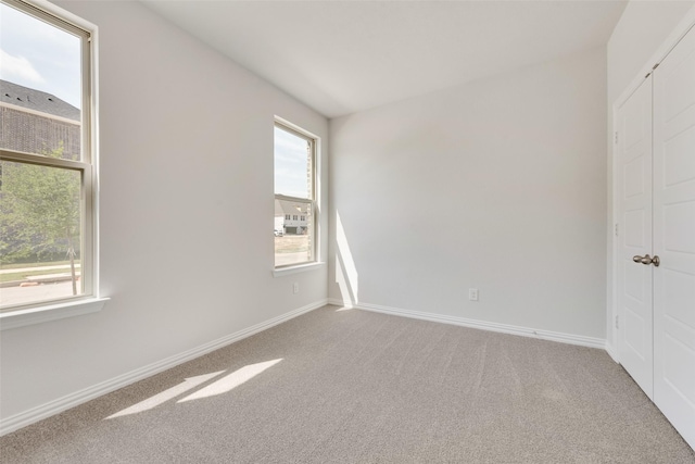 4301 Ruth Rd, North Richland Hills, TX 76180 - empty room with baseboards, carpet floors, and a healthy amount of sunlight