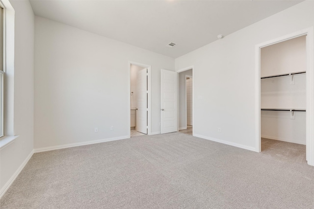 4301 Ruth Rd, North Richland Hills, TX 76180 - unfurnished bedroom with a walk in closet, carpet, and baseboards
