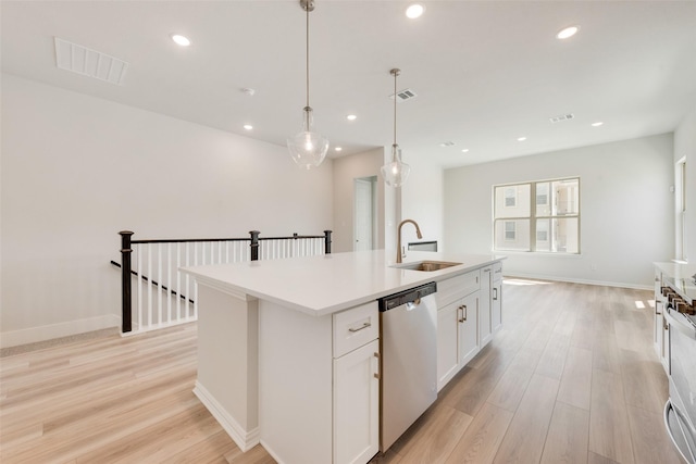 4301 Ruth Rd, North Richland Hills, TX 76180 - kitchen with stainless steel dishwasher, a sink, light wood-type flooring, a center island with sink, and visible vents