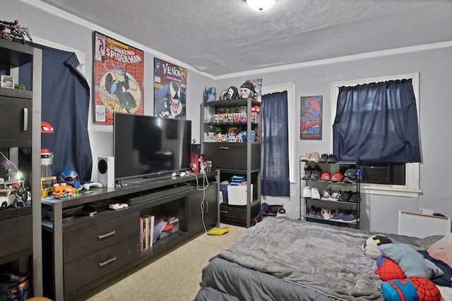 bedroom featuring cooling unit and a textured ceiling