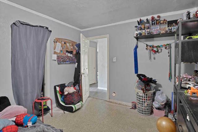 bedroom with tile patterned floors, baseboards, and ornamental molding