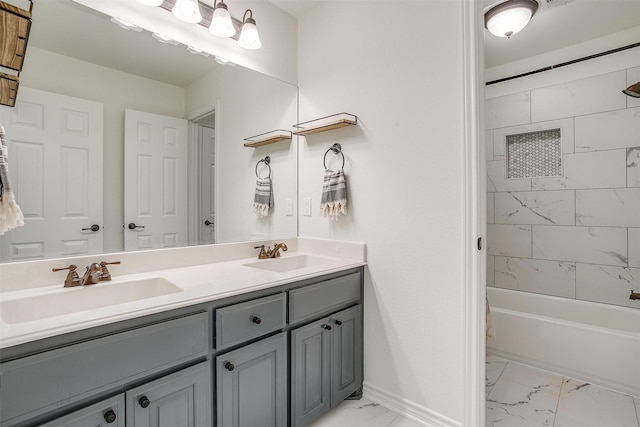 bathroom with double vanity, shower / washtub combination, marble finish floor, and a sink