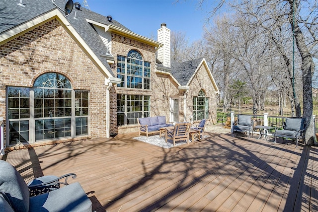 wooden terrace featuring outdoor lounge area