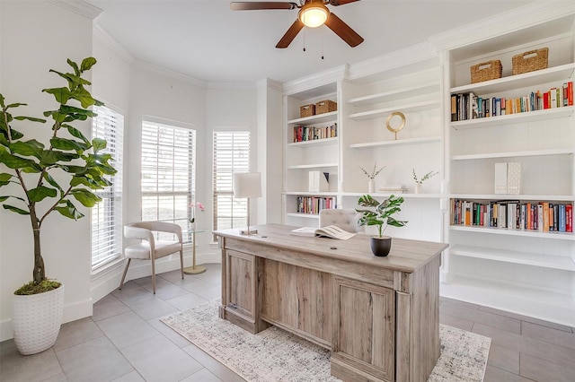 office area featuring light tile patterned floors, built in shelves, baseboards, ornamental molding, and ceiling fan