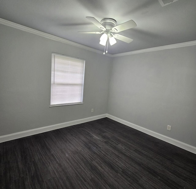 spare room with ceiling fan, dark wood-type flooring, crown molding, and baseboards