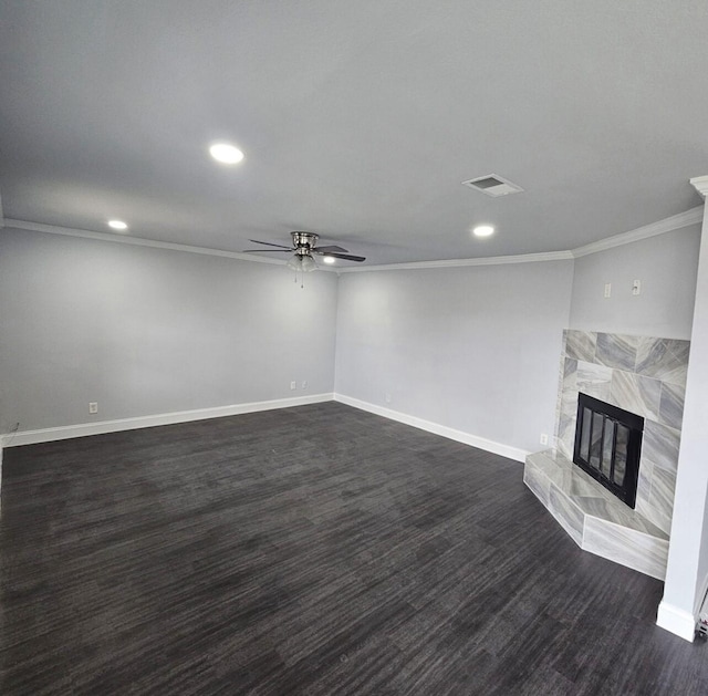 unfurnished living room featuring visible vents, a ceiling fan, baseboards, dark wood-style flooring, and a tile fireplace