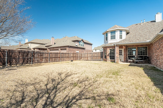 view of yard with a patio and a fenced backyard