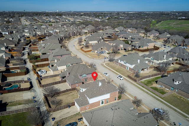 birds eye view of property with a residential view