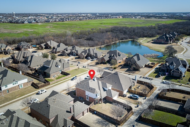 birds eye view of property featuring a residential view and a water view