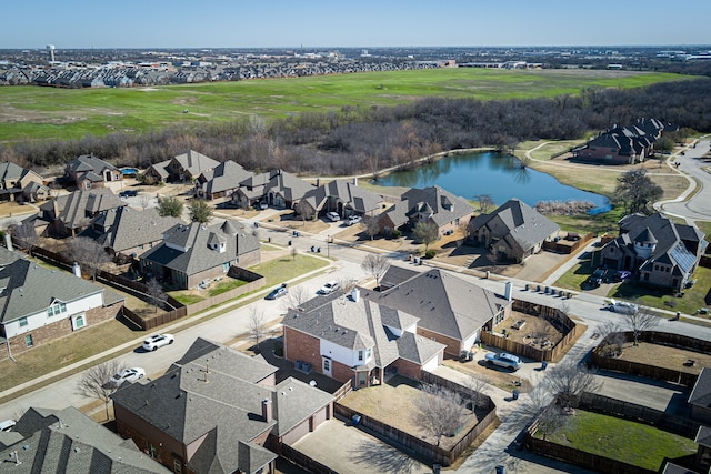 bird's eye view featuring a residential view and a water view