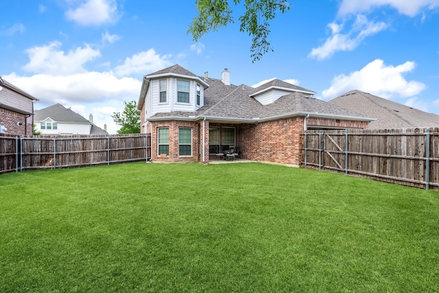 3506 Edinburgh Dr, Sachse, TX 75048 - rear view of property with brick siding, a chimney, roof with shingles, and a patio area