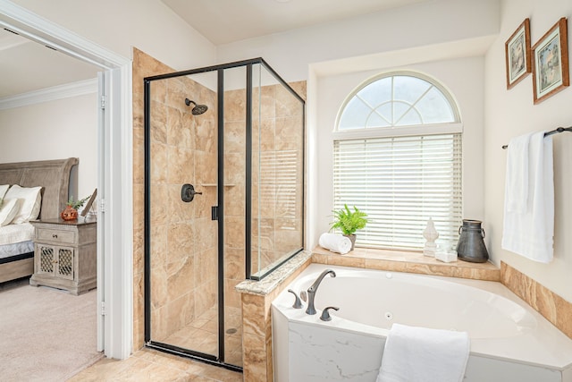 ensuite bathroom featuring ensuite bathroom, a bath, a shower stall, and crown molding