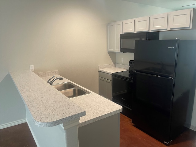 kitchen featuring black appliances, a sink, white cabinetry, a peninsula, and light countertops