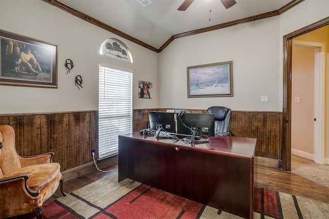 office space featuring wainscoting, ornamental molding, wood walls, and ceiling fan