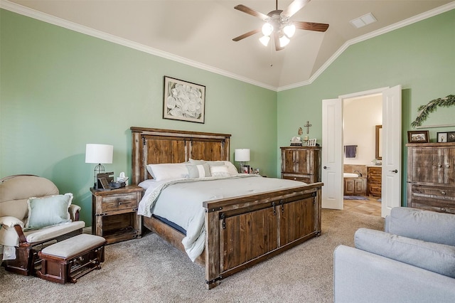 bedroom with visible vents, ensuite bathroom, crown molding, light colored carpet, and vaulted ceiling