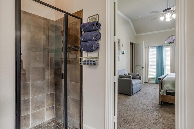 ensuite bathroom with a ceiling fan, a stall shower, ensuite bathroom, and crown molding