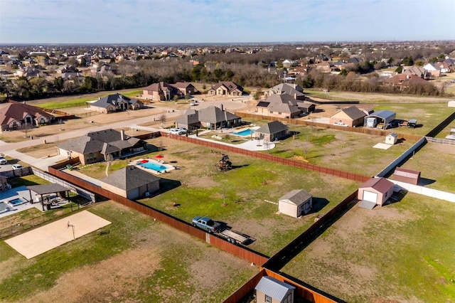 birds eye view of property with a residential view