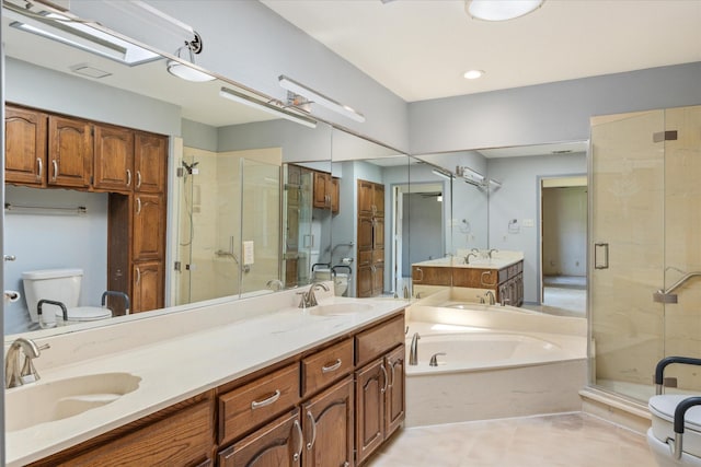 full bath featuring a shower stall, a garden tub, double vanity, and a sink