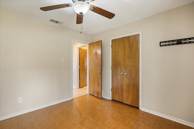 unfurnished bedroom featuring visible vents, light floors, baseboards, and ceiling fan