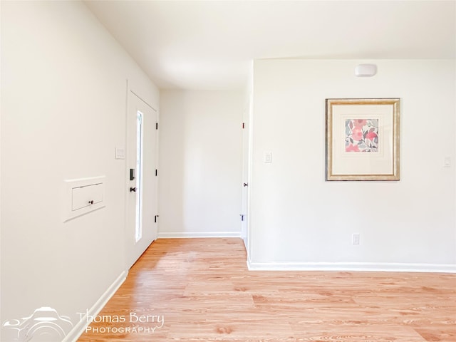 entrance foyer featuring light wood-type flooring and baseboards