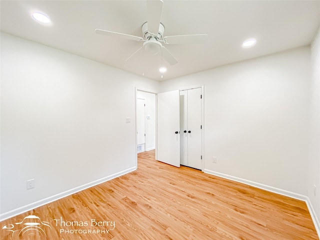 empty room with recessed lighting, light wood-style flooring, baseboards, and a ceiling fan