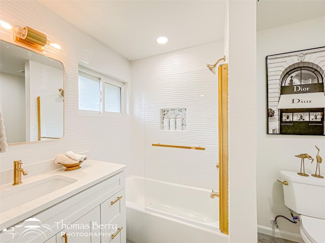 bathroom with toilet, vanity, and bathing tub / shower combination