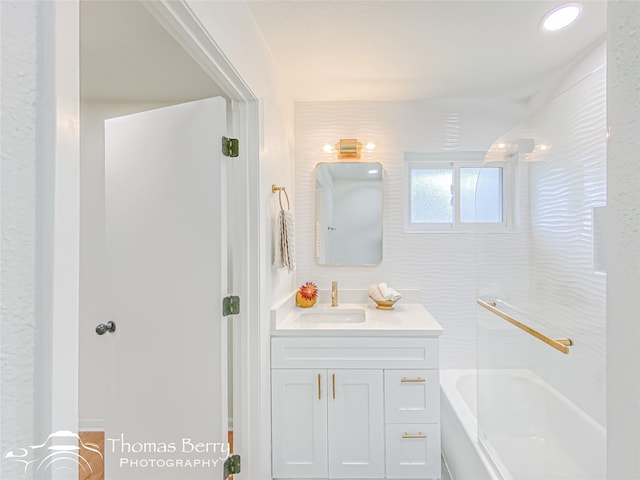 bathroom with shower / bathing tub combination and vanity