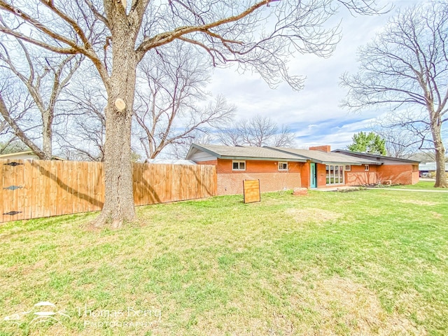 view of yard with fence