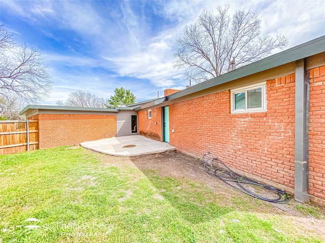 view of yard with a patio area and fence