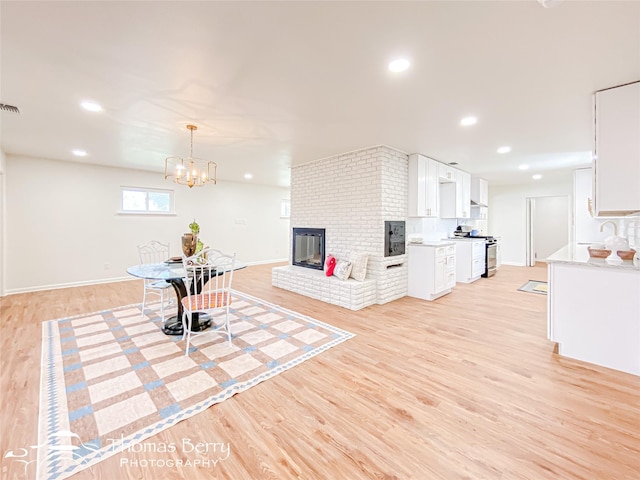 interior space with recessed lighting, light wood-type flooring, and visible vents