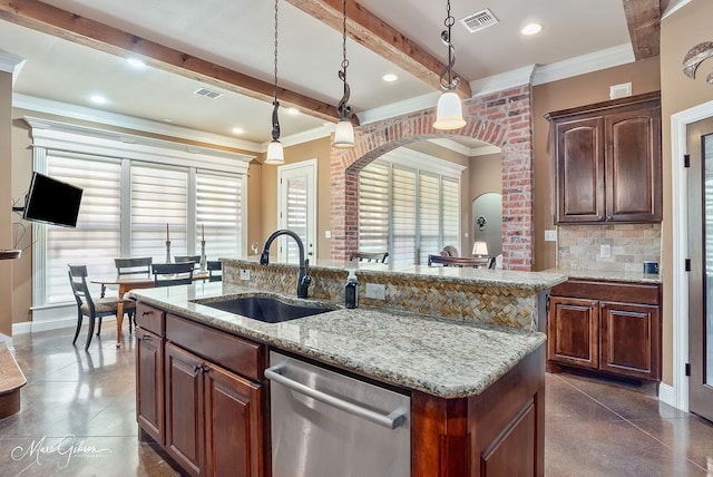 kitchen featuring visible vents, beamed ceiling, decorative backsplash, stainless steel dishwasher, and a sink