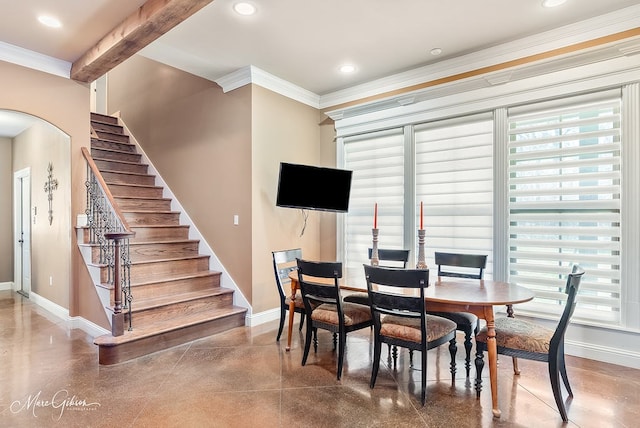 dining space with stairway, recessed lighting, baseboards, and arched walkways