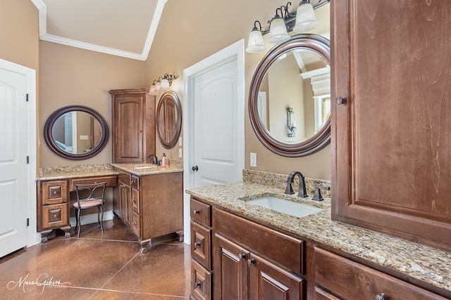 bathroom with crown molding, two vanities, and a sink