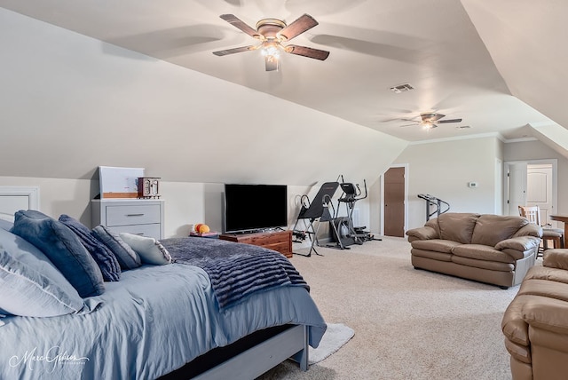 carpeted bedroom with visible vents, a ceiling fan, and vaulted ceiling