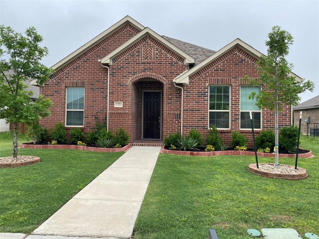 1521 Addison Dr, Lancaster, TX 75134 - ranch-style home with brick siding and a front yard