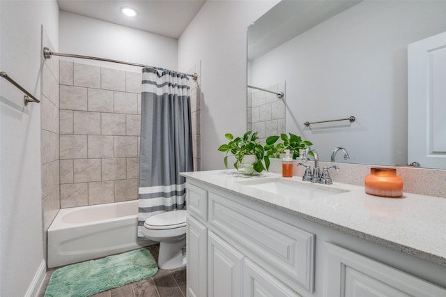 bathroom featuring toilet, shower / bathtub combination with curtain, wood finished floors, and vanity