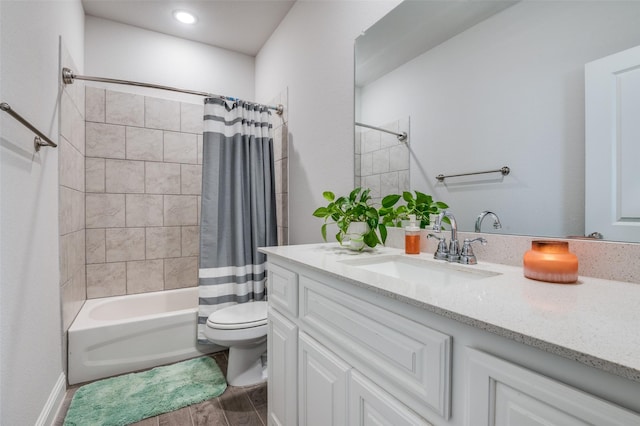 full bath with vanity, toilet, and shower / bath combo