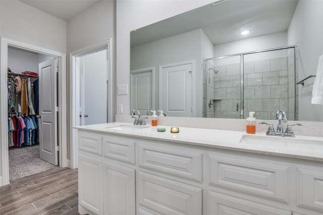 1521 Addison Dr, Lancaster, TX 75134 - bathroom with double vanity, a sink, and a stall shower