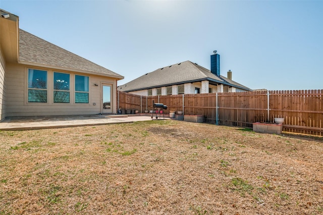 view of yard featuring a patio and a fenced backyard