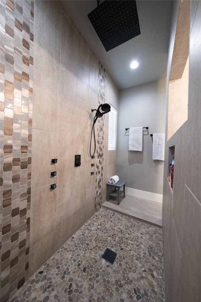 full bath with tiled shower