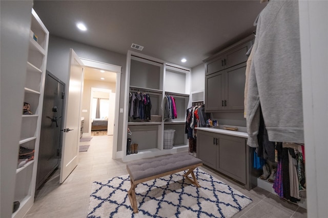 walk in closet with visible vents