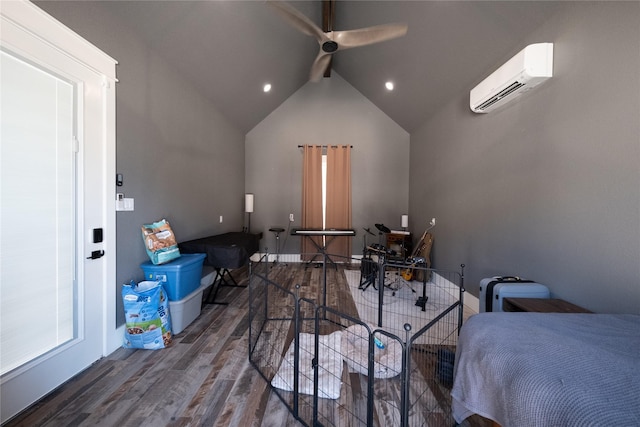 bedroom with ceiling fan, a wall unit AC, wood finished floors, and vaulted ceiling