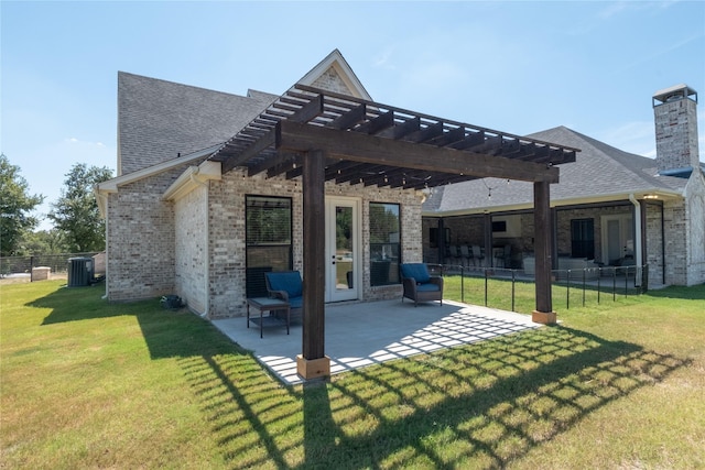 rear view of property featuring brick siding, a patio, a lawn, and a pergola