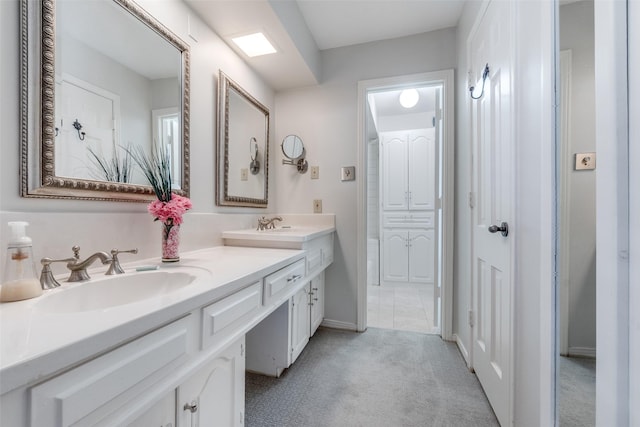 bathroom featuring double vanity and a sink