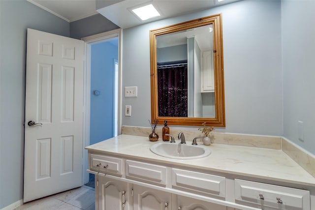 bathroom with vanity and ornamental molding