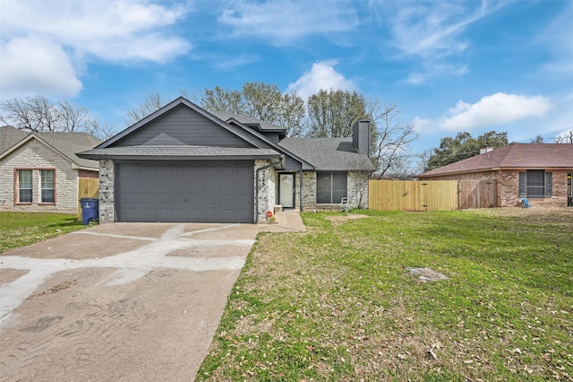 view of front facade with driveway, fence, a front yard, a shingled roof, and a garage