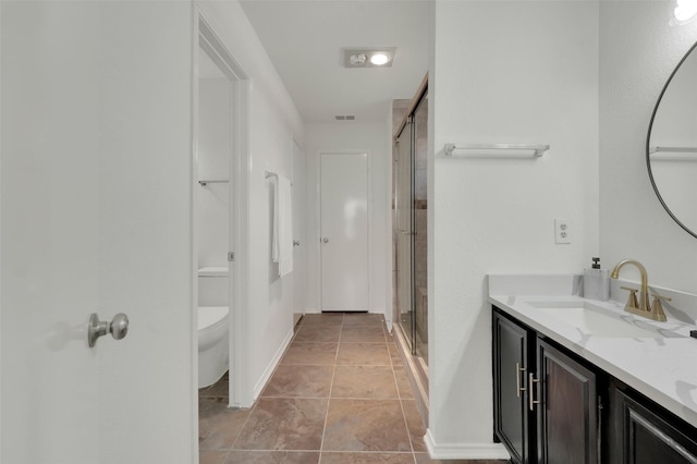 full bathroom with visible vents, a shower stall, baseboards, toilet, and vanity