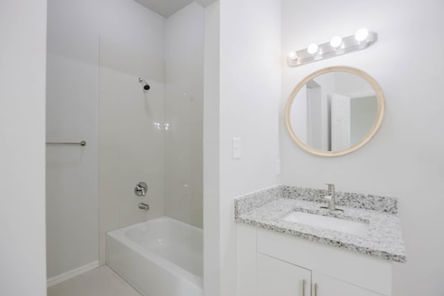 full bathroom featuring baseboards, bathing tub / shower combination, and vanity